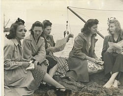The 5 wives on SEFI, 1940. They don't look particularly crazy! Notice the 2 Coast Guard deliverymen in the gantry sling at back, riding with bags of supplies.